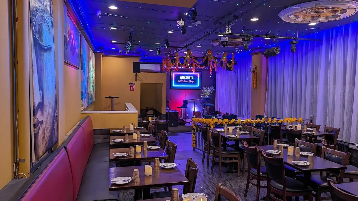 The length of the dining room, blue light washing the ceiling