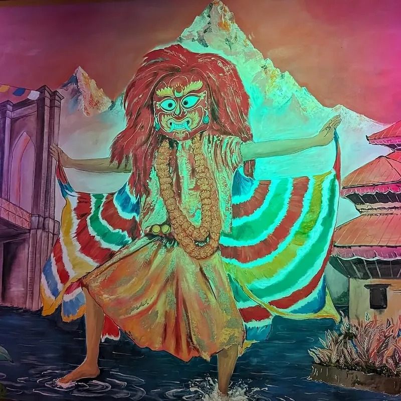 The hand-painted Lakhey dancer against the Himalaya and Newari pagoda houses