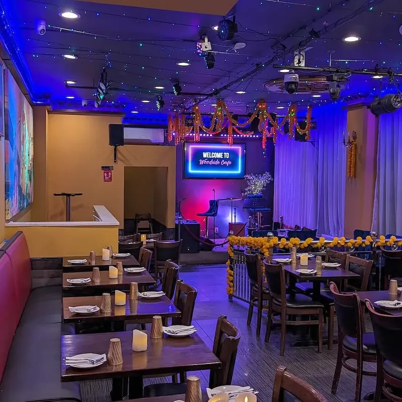 The length of the dining room, blue light washing the ceiling